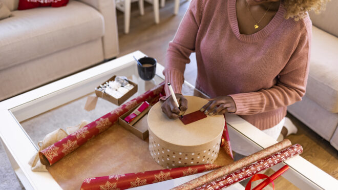 Woman wrapping a round box