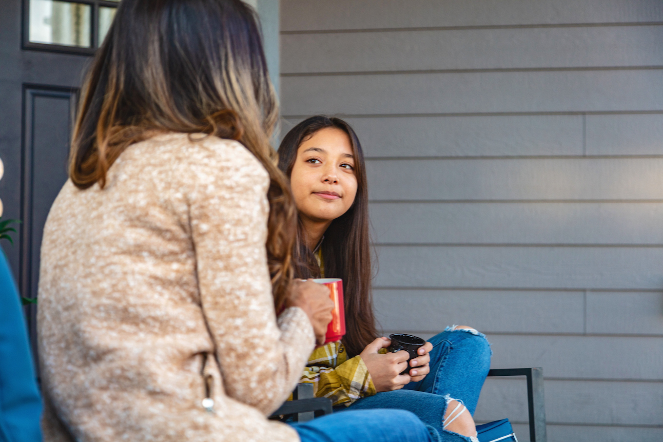 Mom and daughter talking outside