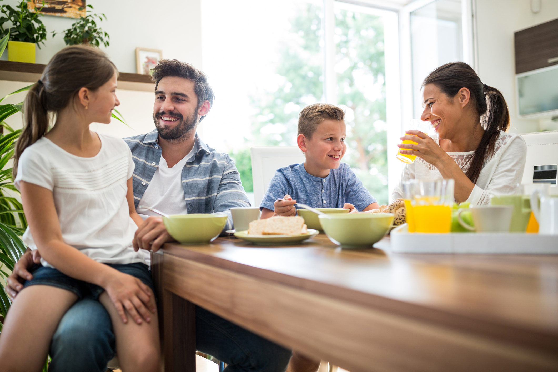 Happy family having breakfast